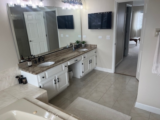 bathroom with tile patterned flooring and vanity