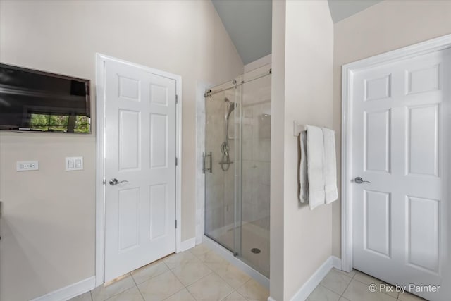 bathroom with tile patterned floors and an enclosed shower