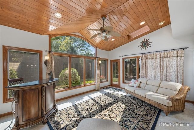 sunroom / solarium featuring ceiling fan, wood ceiling, and vaulted ceiling