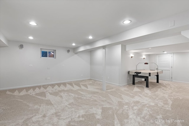 basement featuring light carpet