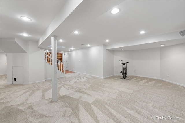 basement featuring light carpet