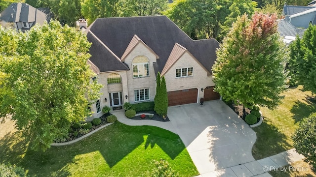 view of front of property with a garage and a front yard