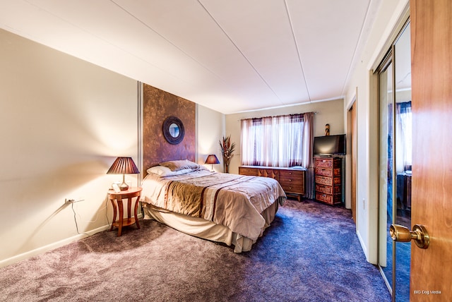 bedroom featuring dark colored carpet