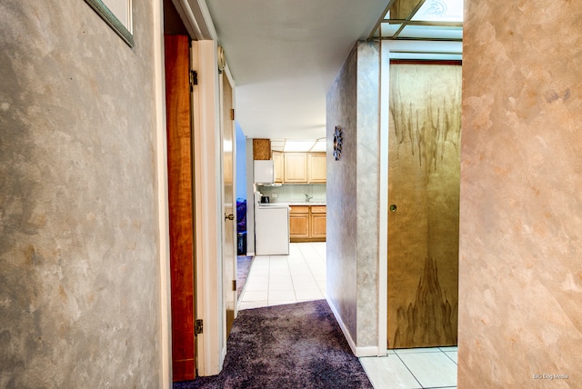 hallway with light tile patterned floors