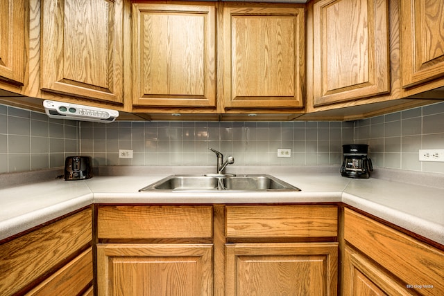 kitchen with decorative backsplash and sink