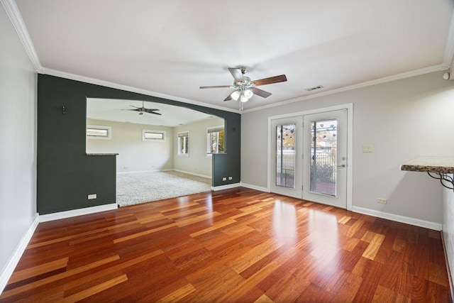 unfurnished room with ceiling fan, hardwood / wood-style floors, crown molding, and plenty of natural light