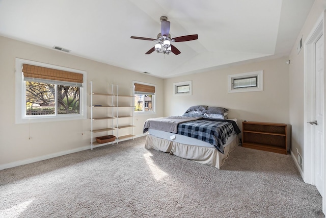 carpeted bedroom featuring vaulted ceiling and ceiling fan