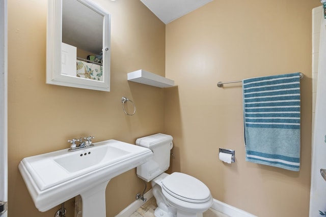 bathroom with sink and toilet