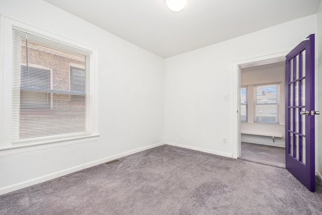 view of carpeted spare room