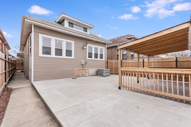 back of house with a patio