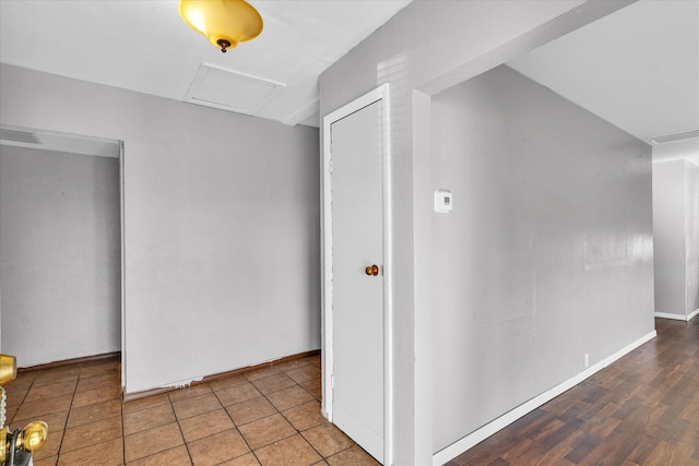 hallway with hardwood / wood-style floors