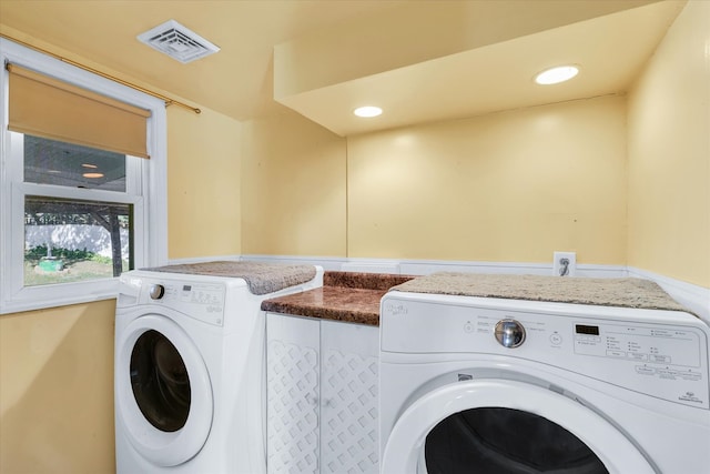 laundry area featuring washing machine and clothes dryer