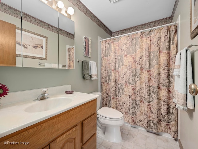 bathroom featuring walk in shower, vanity, and toilet