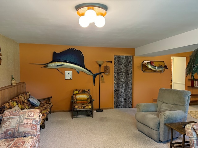 living room featuring carpet floors and a notable chandelier