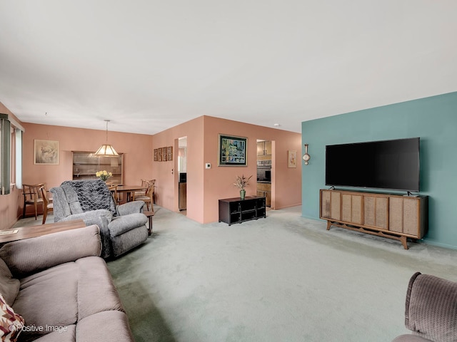 living room featuring carpet flooring and a healthy amount of sunlight