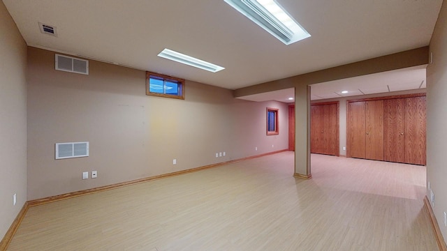 basement with light wood-type flooring