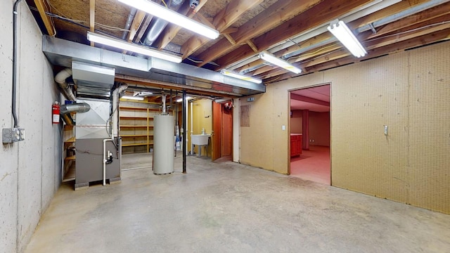 basement with gas water heater and heating unit