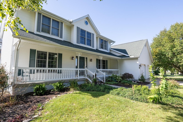 view of front of property with a porch and a garage