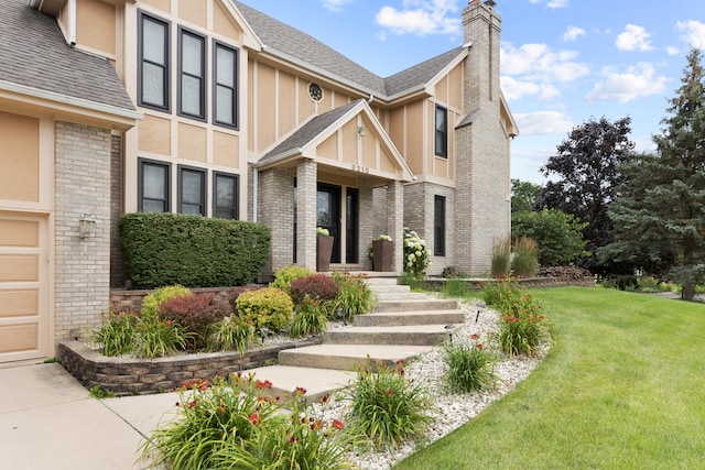 exterior space featuring a front lawn and a garage