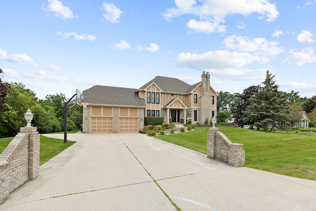 view of front of property with a garage and a front lawn