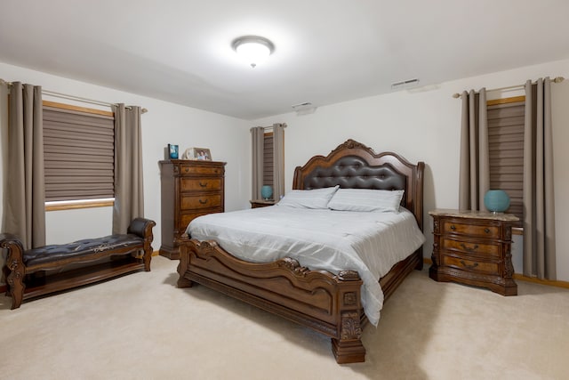 bedroom with light carpet