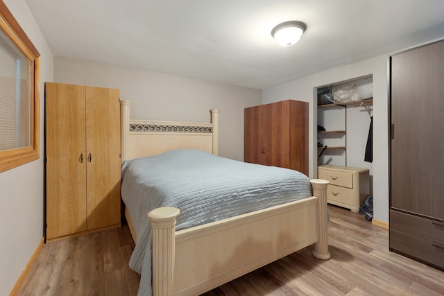 bedroom with light hardwood / wood-style flooring