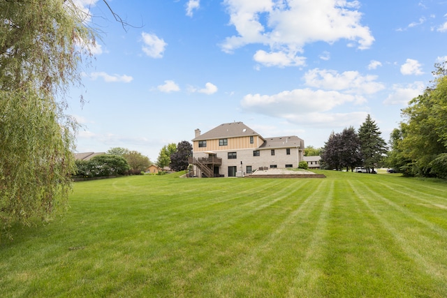 rear view of house with a lawn