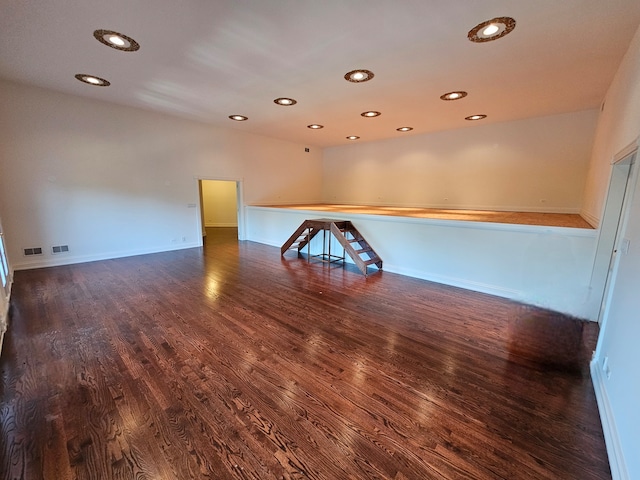 empty room featuring dark wood-type flooring