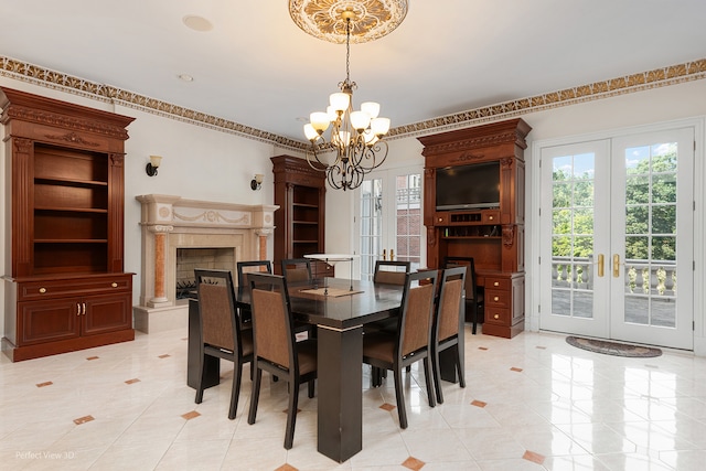 dining space with a high end fireplace, light tile patterned floors, a chandelier, and french doors