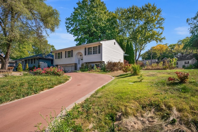 bi-level home with a front yard