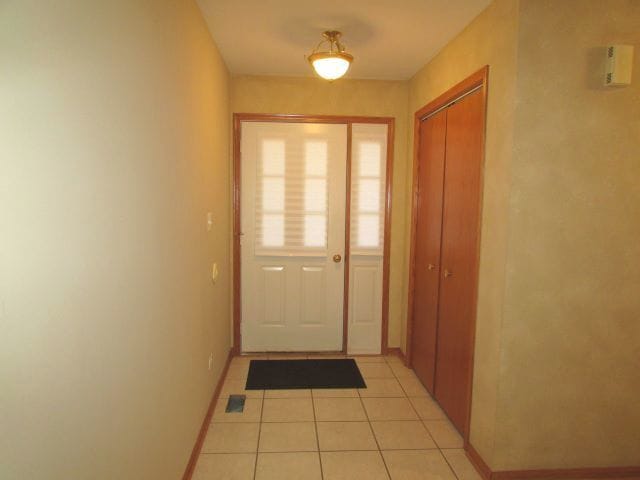 entryway featuring light tile patterned floors