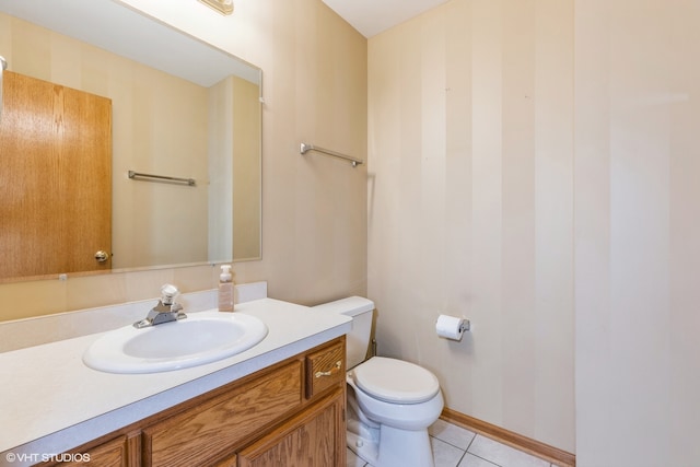 bathroom with tile patterned floors, vanity, and toilet