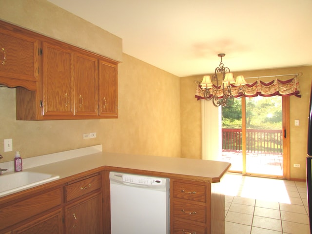 kitchen with sink, kitchen peninsula, a notable chandelier, white dishwasher, and decorative light fixtures