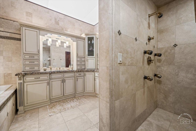 bathroom featuring vanity and a tile shower