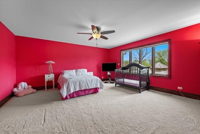 carpeted bedroom featuring access to exterior, ceiling fan, visible vents, and baseboards