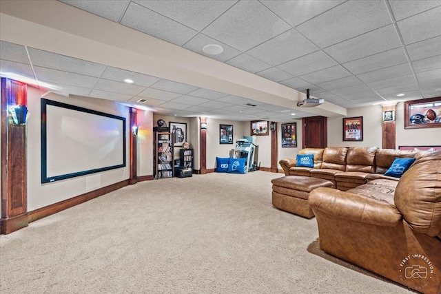 carpeted home theater room with recessed lighting, a drop ceiling, and baseboards