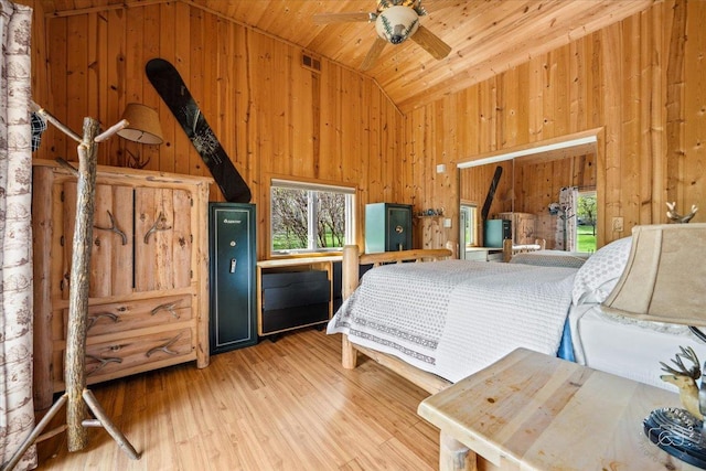 bedroom with ceiling fan, high vaulted ceiling, wooden ceiling, and wood-type flooring