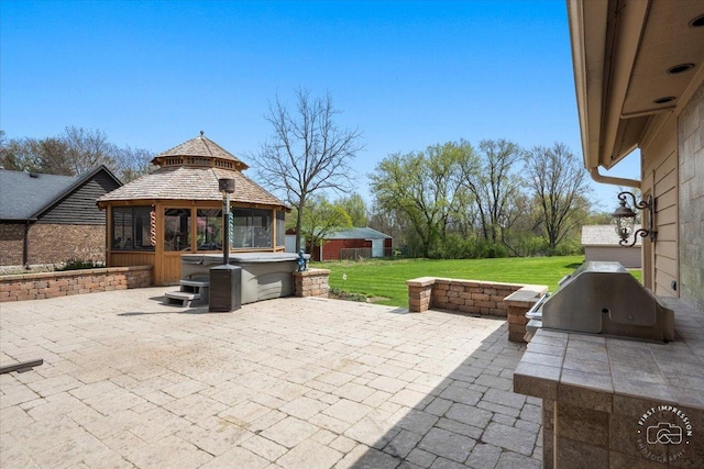 view of patio featuring a gazebo and a grill