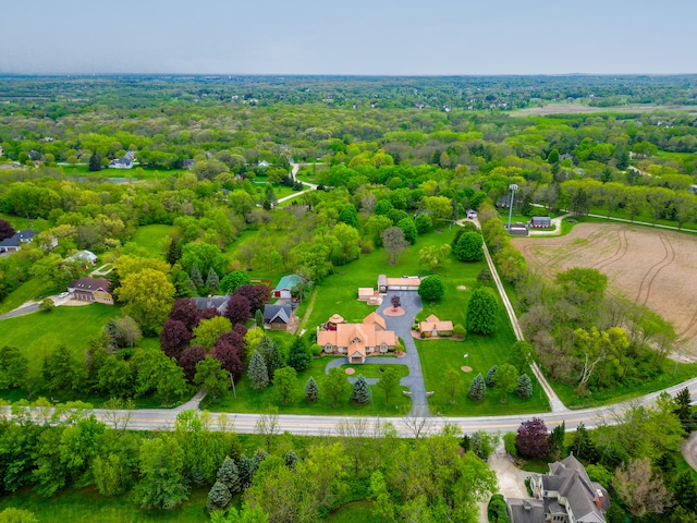 birds eye view of property with a forest view