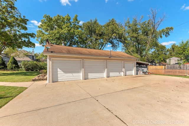 garage featuring a yard