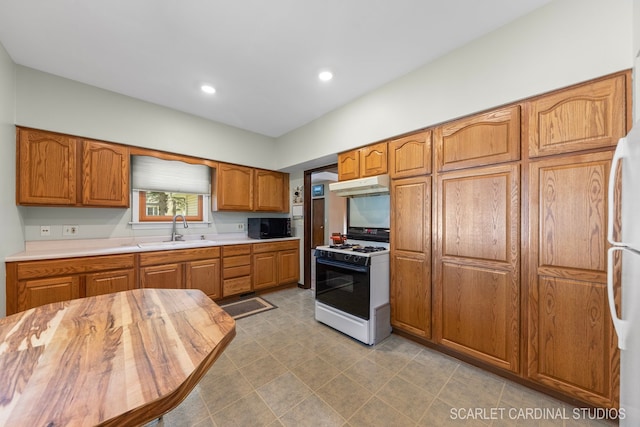 kitchen with sink and white appliances