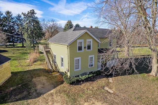 view of home's exterior with a lawn