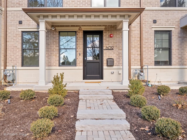 doorway to property featuring covered porch