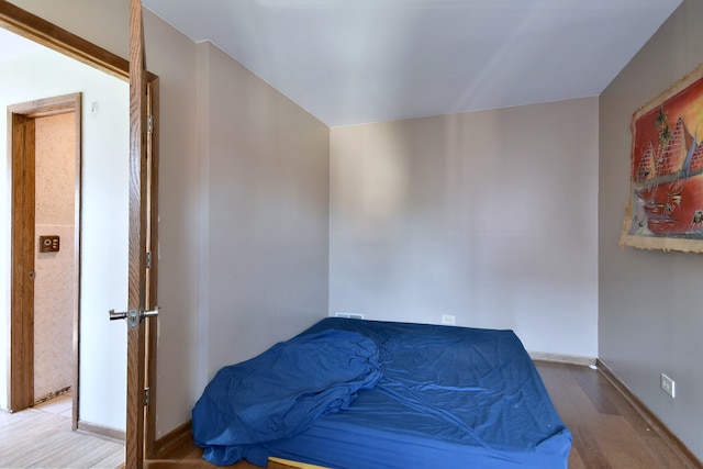 bedroom with hardwood / wood-style floors