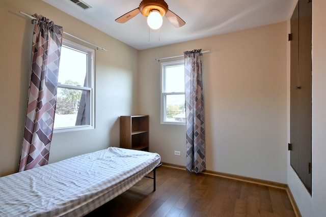 bedroom featuring ceiling fan and dark hardwood / wood-style flooring