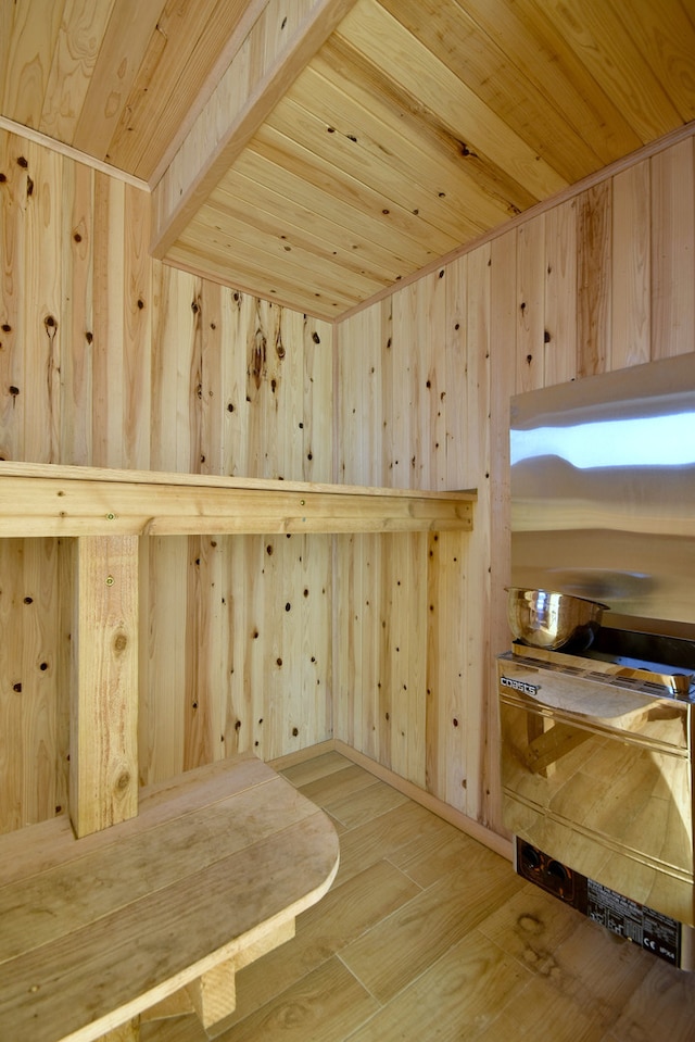 view of sauna with wood ceiling, wood walls, and hardwood / wood-style floors