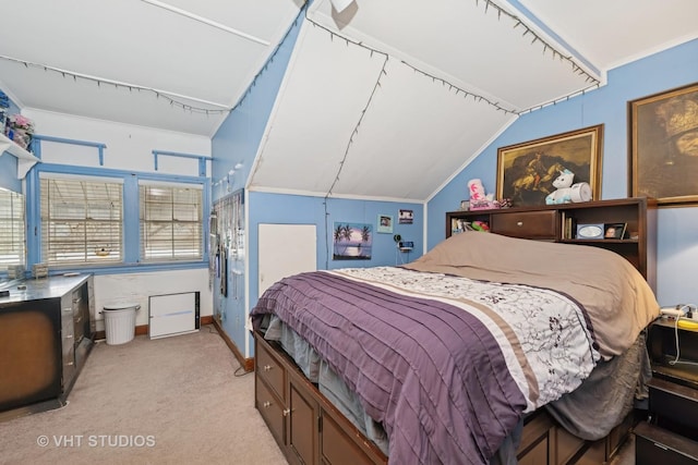 bedroom with light colored carpet, baseboards, crown molding, and lofted ceiling