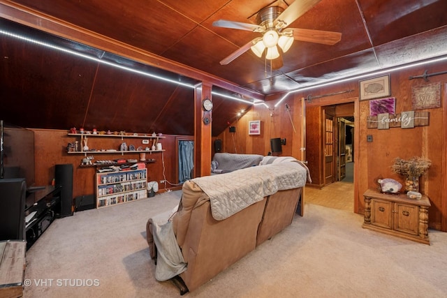 interior space featuring wooden walls and ceiling fan