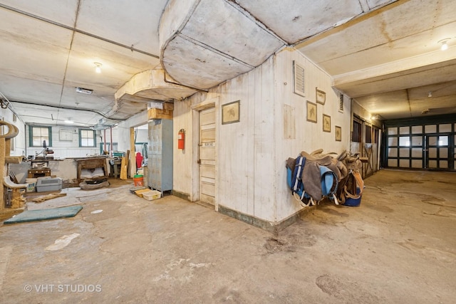 miscellaneous room featuring unfinished concrete floors