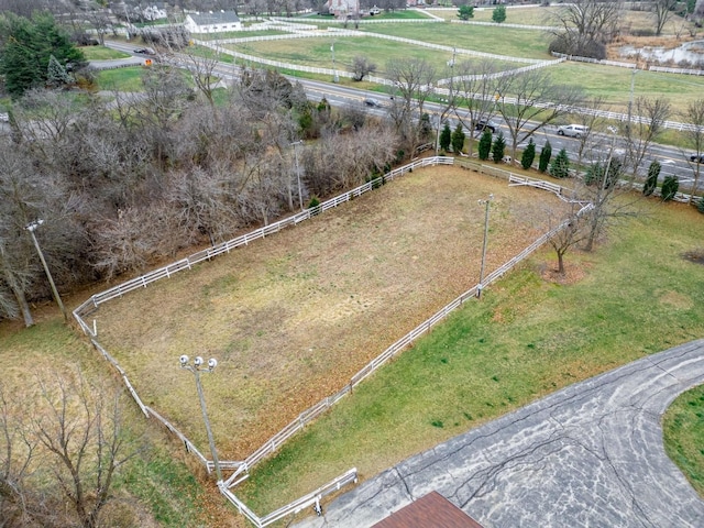 birds eye view of property with a rural view